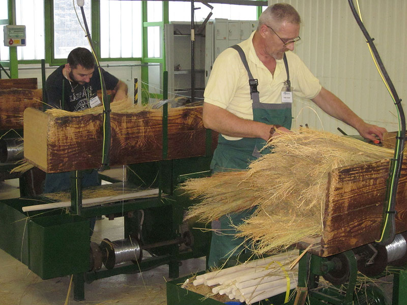 Workers are making brooms.